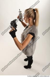 NIKOL STANDING POSE WITH TWO GUNS